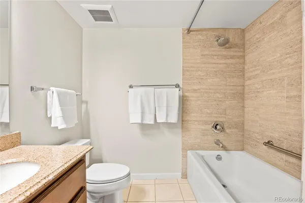 a front view of a residential apartment building with a yard