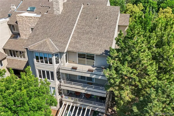 an aerial view of a house with a yard and plants
