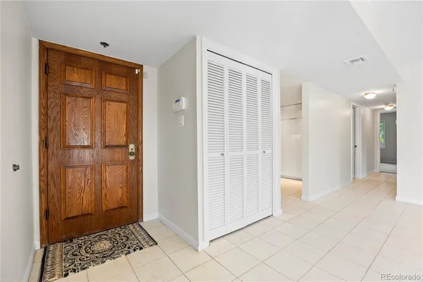 a view of a hallway with closet area