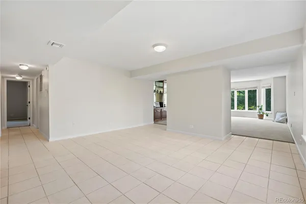 a view of an empty room and window