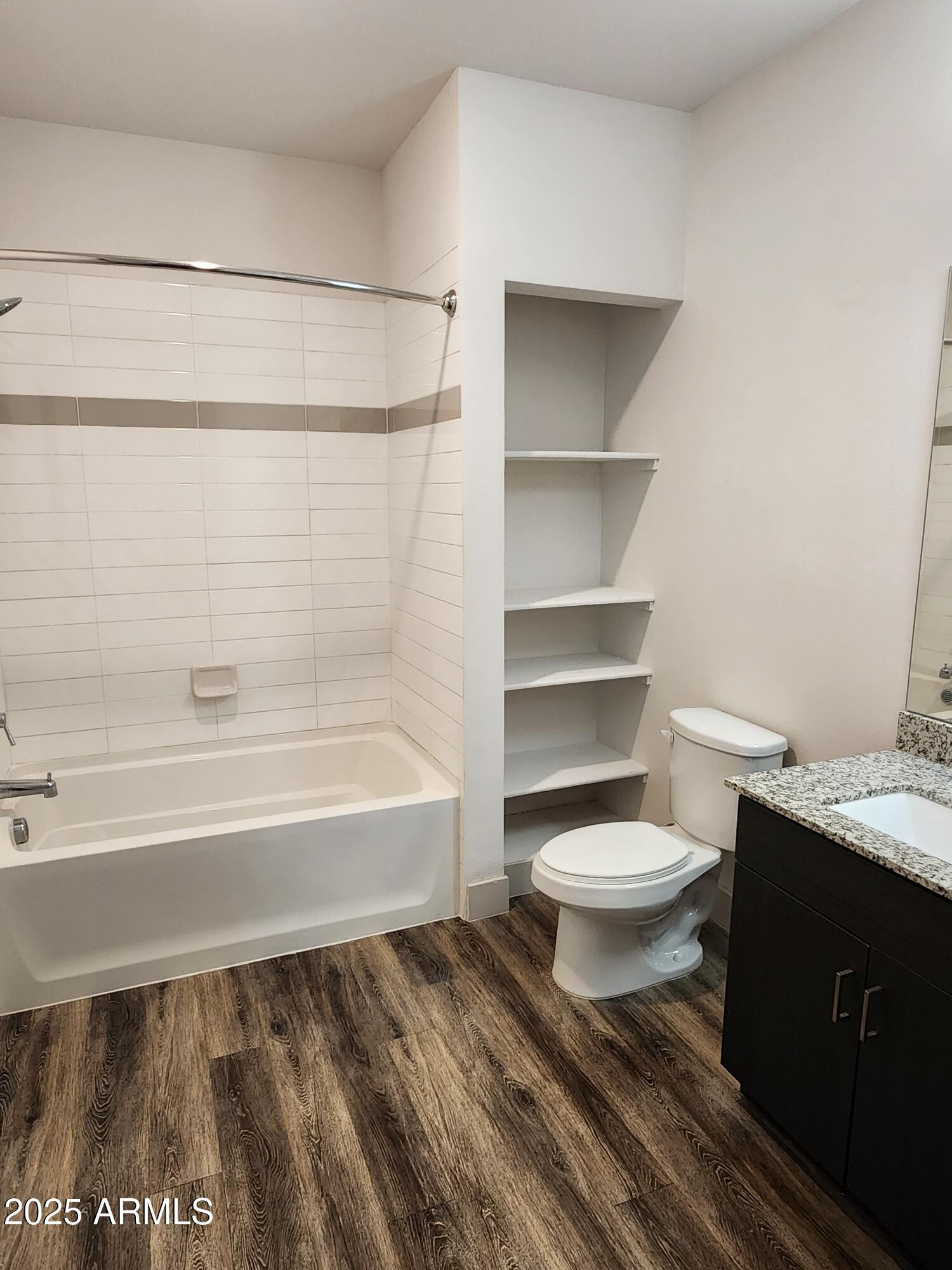 250 East Ray Road, Unit 2 Chandler, AZ 85225 - Photo 7 of 16 a bathroom with a toilet and a bathtub