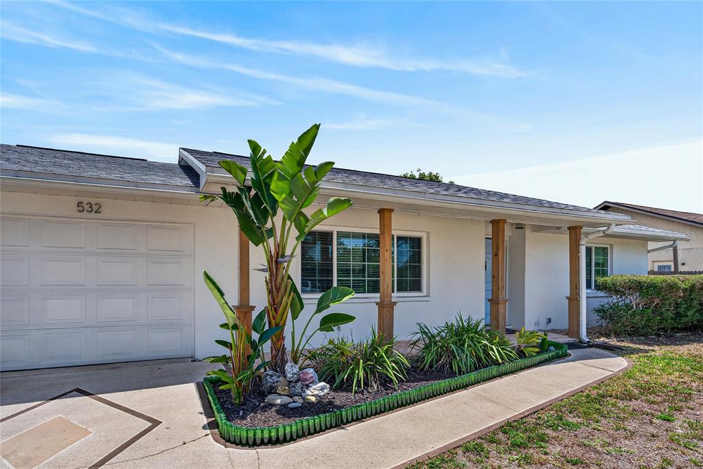 532 Center Road Venice, FL 34285 - Photo 1 of 68 a front view of a house with a yard