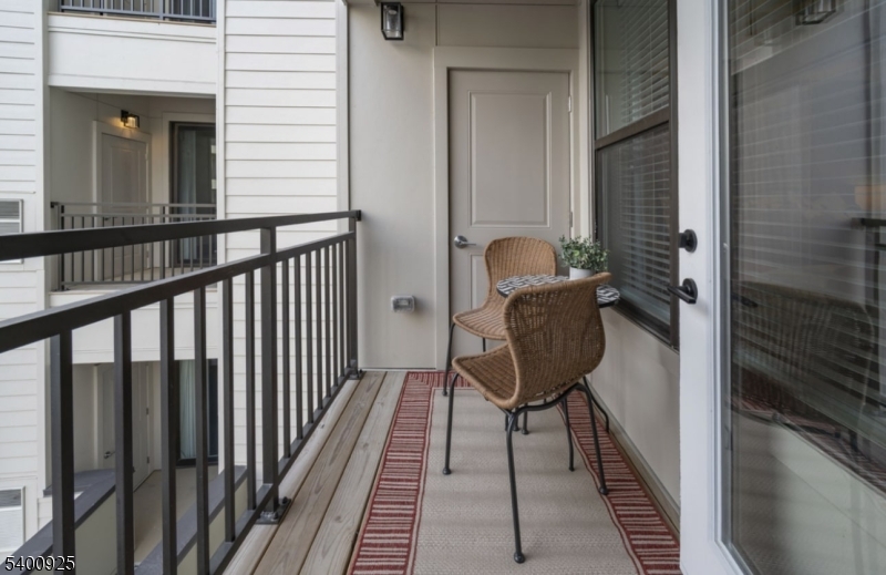 100 Union Street, Unit 353 Elizabeth, NJ 07202 - Photo 11 of 20 a view of a balcony with chair and potted plant
