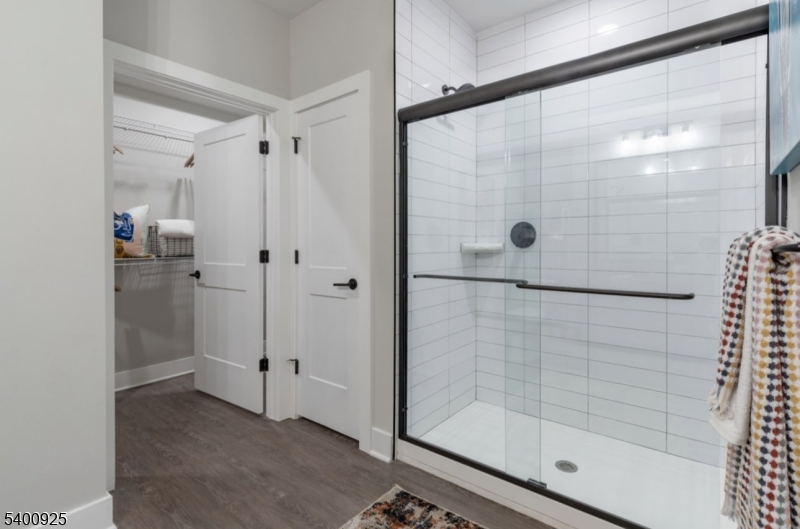 100 Union Street, Unit 353 Elizabeth, NJ 07202 - Photo 15 of 20 a bathroom with a glass shower door