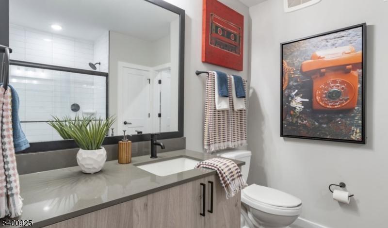 100 Union Street, Unit 353 Elizabeth, NJ 07202 - Photo 16 of 20 a bathroom with a sink a toilet and a shower