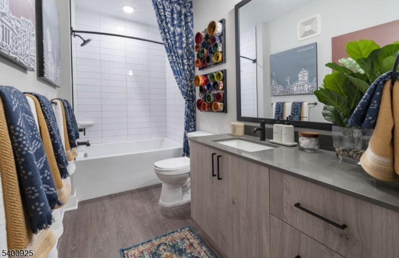 100 Union Street, Unit 353 Elizabeth, NJ 07202 - Photo 3 of 20 a bathroom with a sink a toilet and a bathtub