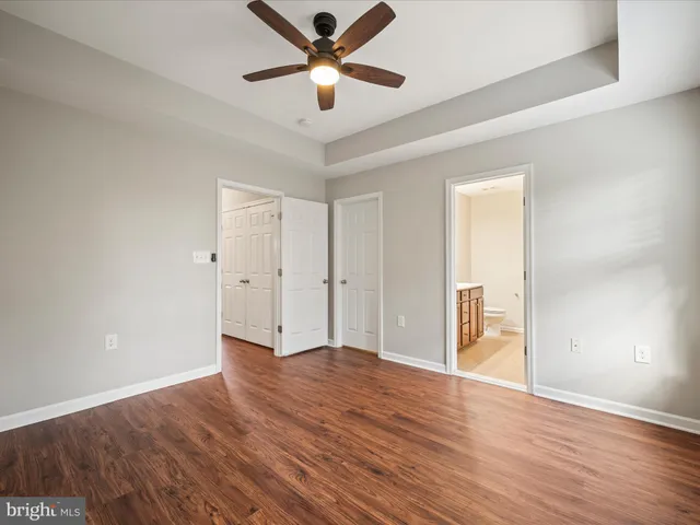 a view of an empty room and wooden floor