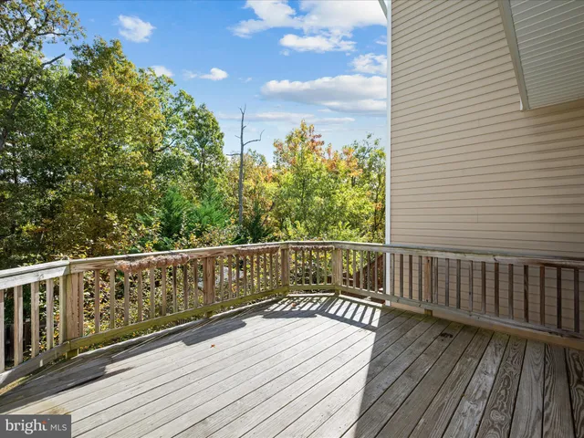 a view of balcony with wooden floor