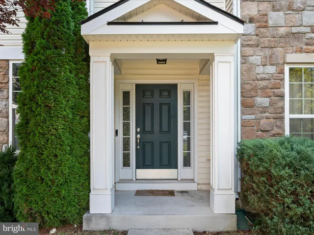 a front view of a house with a white door