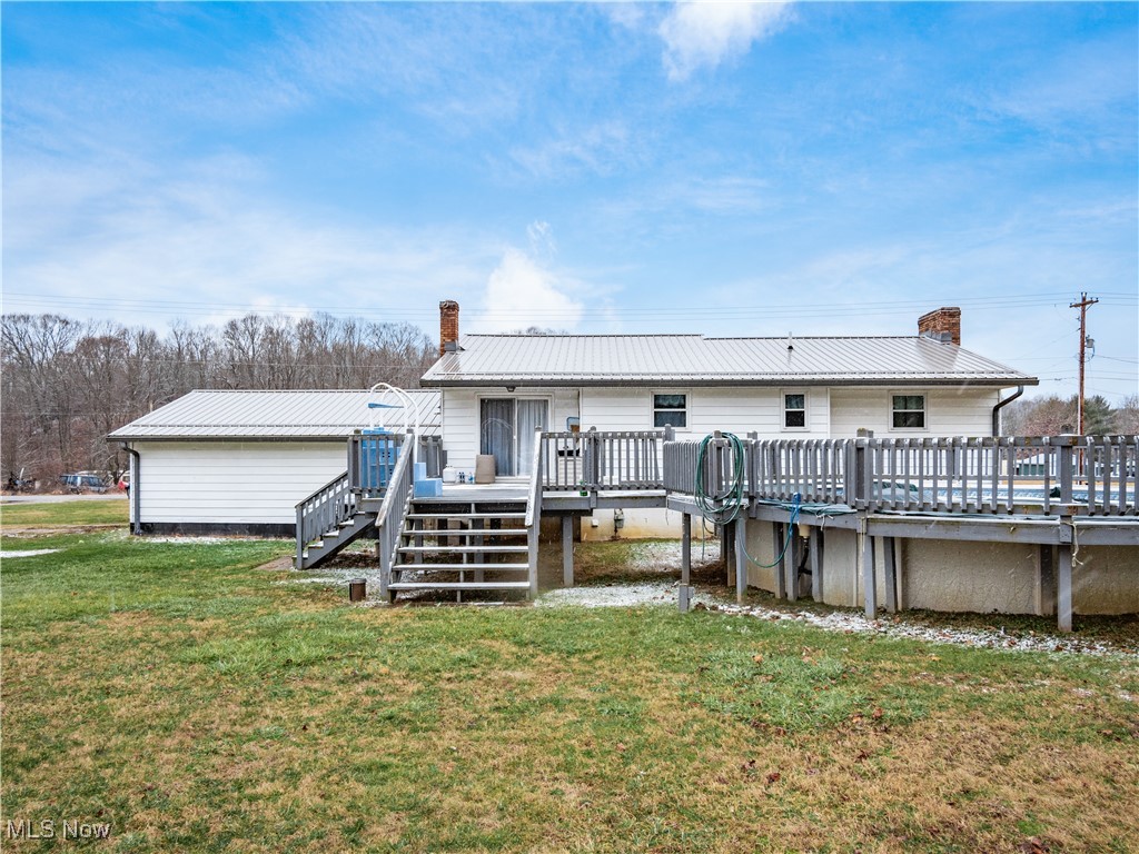12454 Old Rainer Road Roseville, OH 43777 - Photo 28 of 33 Back of property with a wooden deck and a lawn