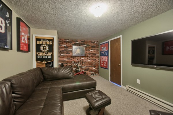 42 Emery Road Townsend, MA 01469 - Photo 24 of 30 a living room with furniture and a flat screen tv