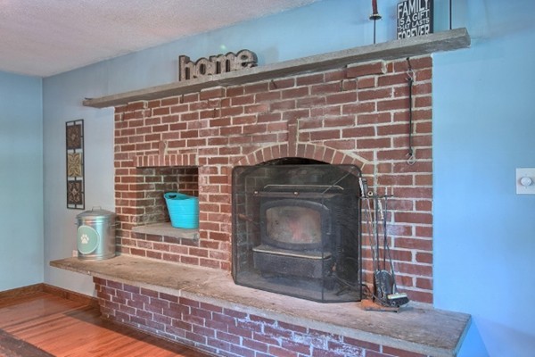 42 Emery Road Townsend, MA 01469 - Photo 5 of 30 a closeup of a fireplace