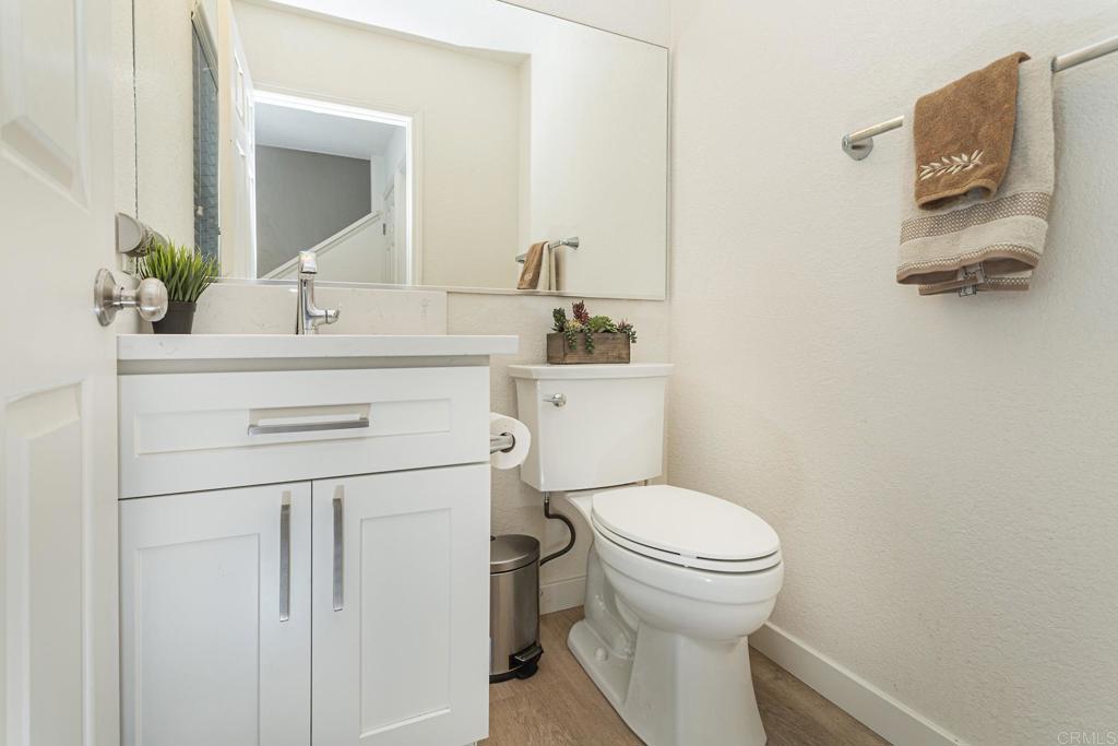 656 Westlake Street Encinitas, CA 92024 - Photo 13 of 41 a bathroom with a sink toilet and mirror