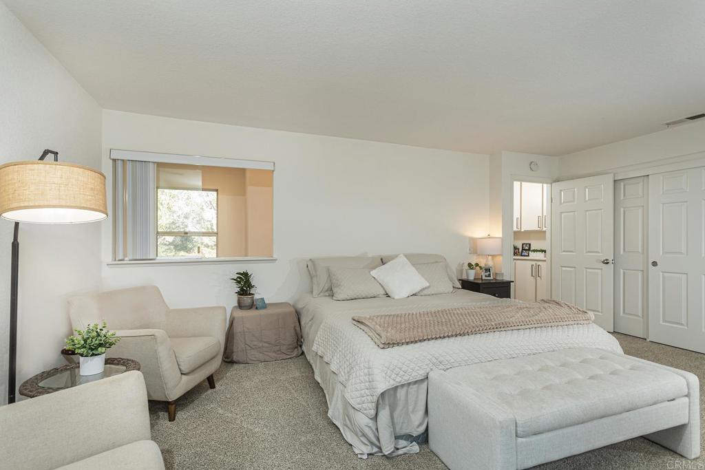 656 Westlake Street Encinitas, CA 92024 - Photo 28 of 41 a bedroom with a bed and a couch