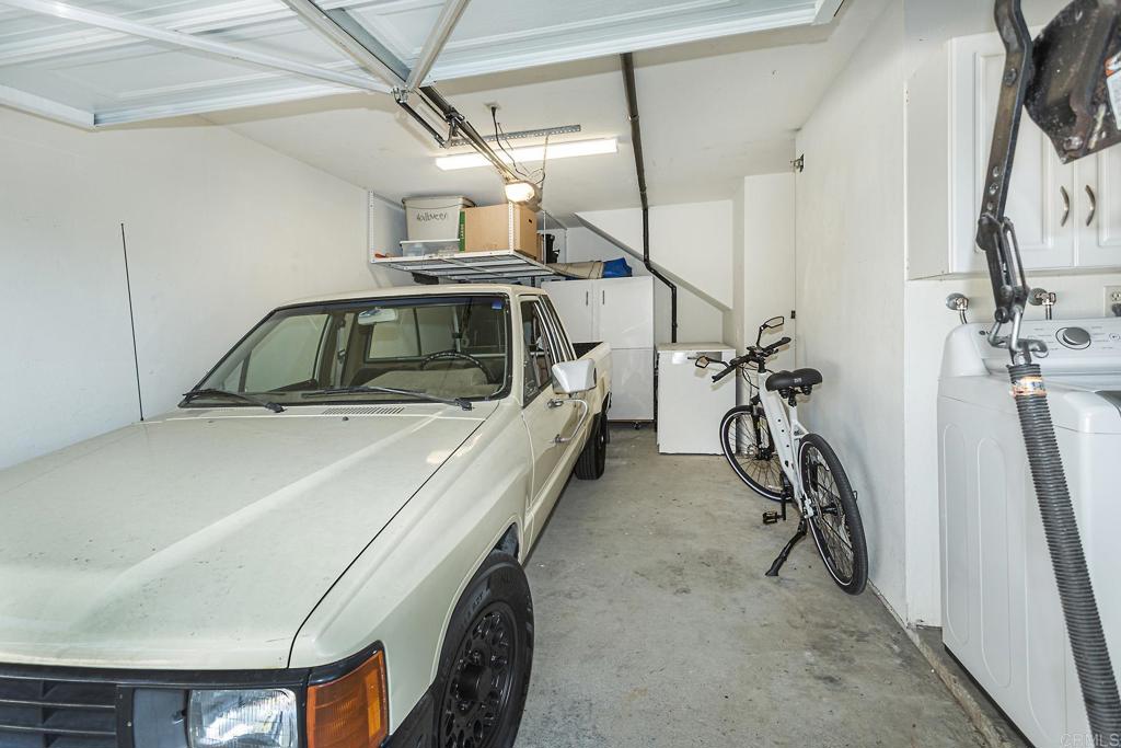656 Westlake Street Encinitas, CA 92024 - Photo 33 of 41 a view of a garage with furniture