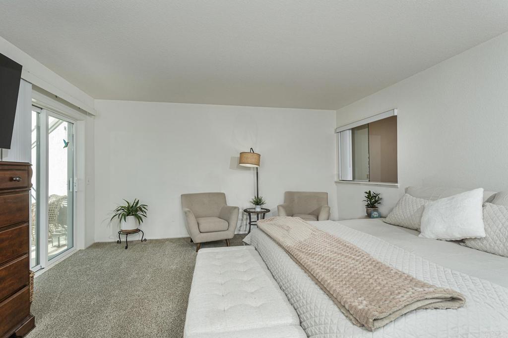 656 Westlake Street Encinitas, CA 92024 - Photo 5 of 41 a bedroom with a bed and a couch