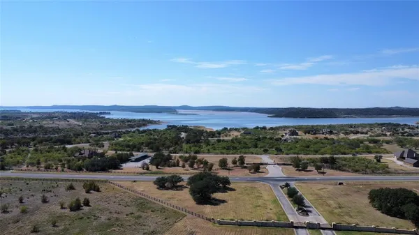 a view of a lake with trees in the background