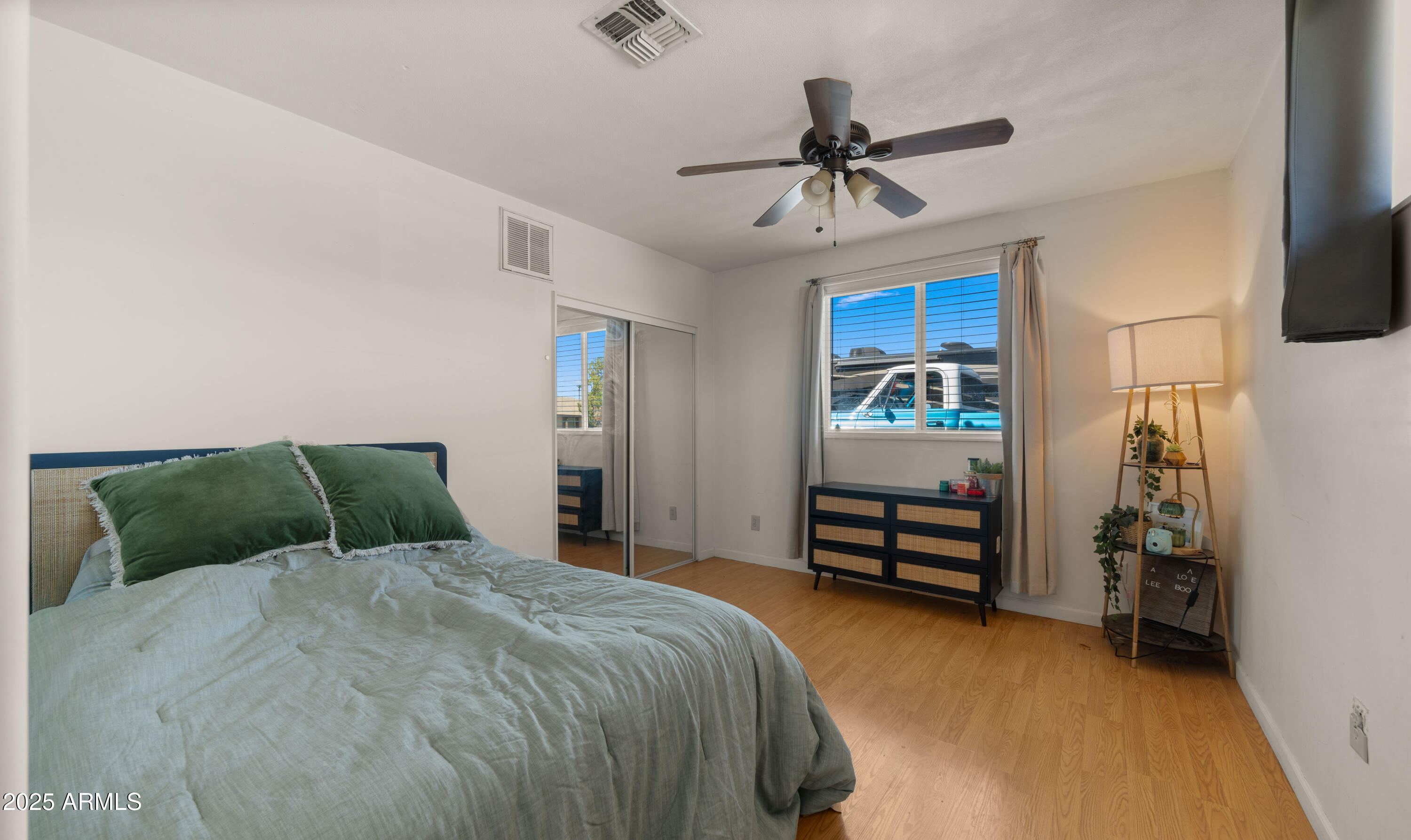 3501 East Coronado Road Phoenix, AZ 85008 - Photo 30 of 57 a bed room with a bed and a ceiling fan