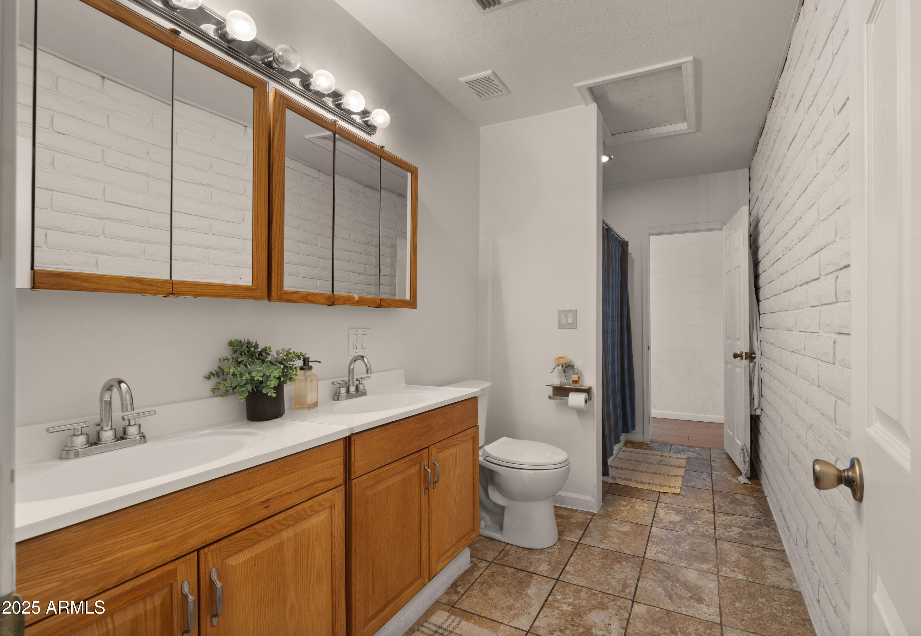 3501 East Coronado Road Phoenix, AZ 85008 - Photo 31 of 57 a bathroom with a double vanity sink mirror and toilet