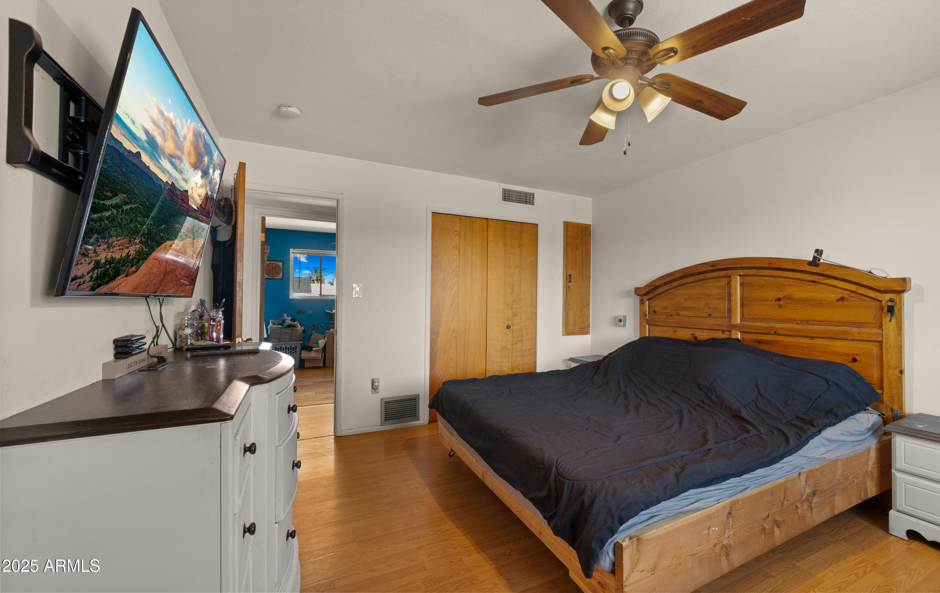 3501 East Coronado Road Phoenix, AZ 85008 - Photo 34 of 57 a bedroom with a bed and a flat tv screen