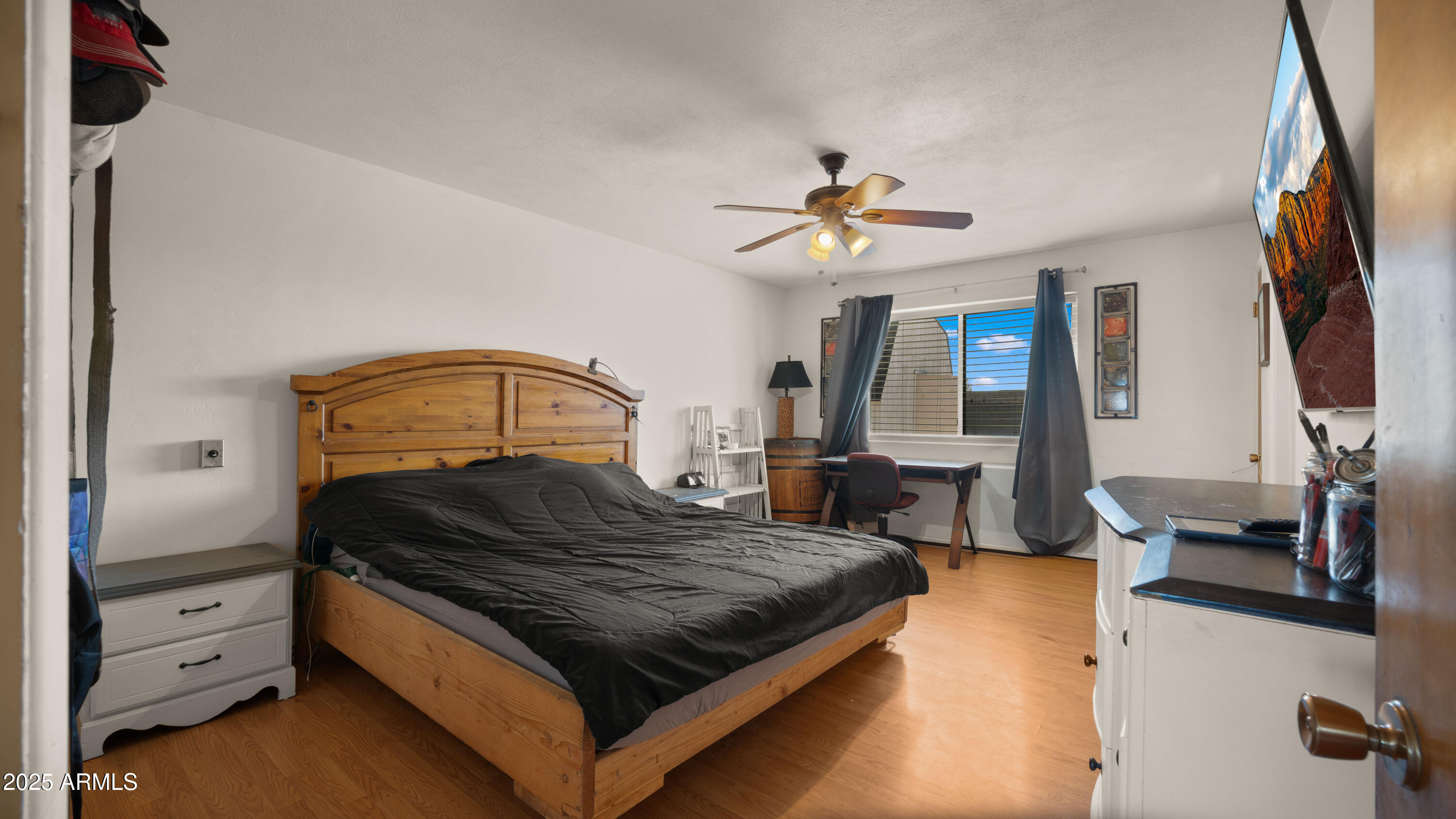 3501 East Coronado Road Phoenix, AZ 85008 - Photo 35 of 57 a bedroom with a large bed and a chandelier