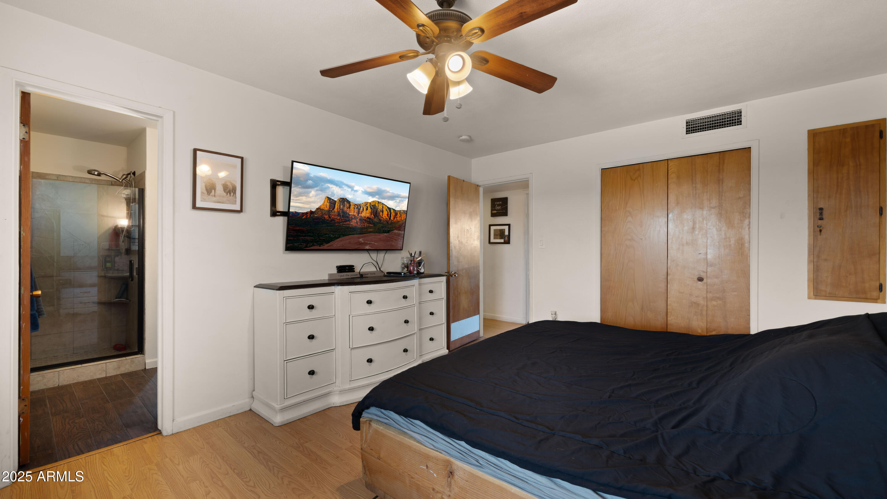 3501 East Coronado Road Phoenix, AZ 85008 - Photo 36 of 57 a bedroom with a bed and a flat tv screen on dresser