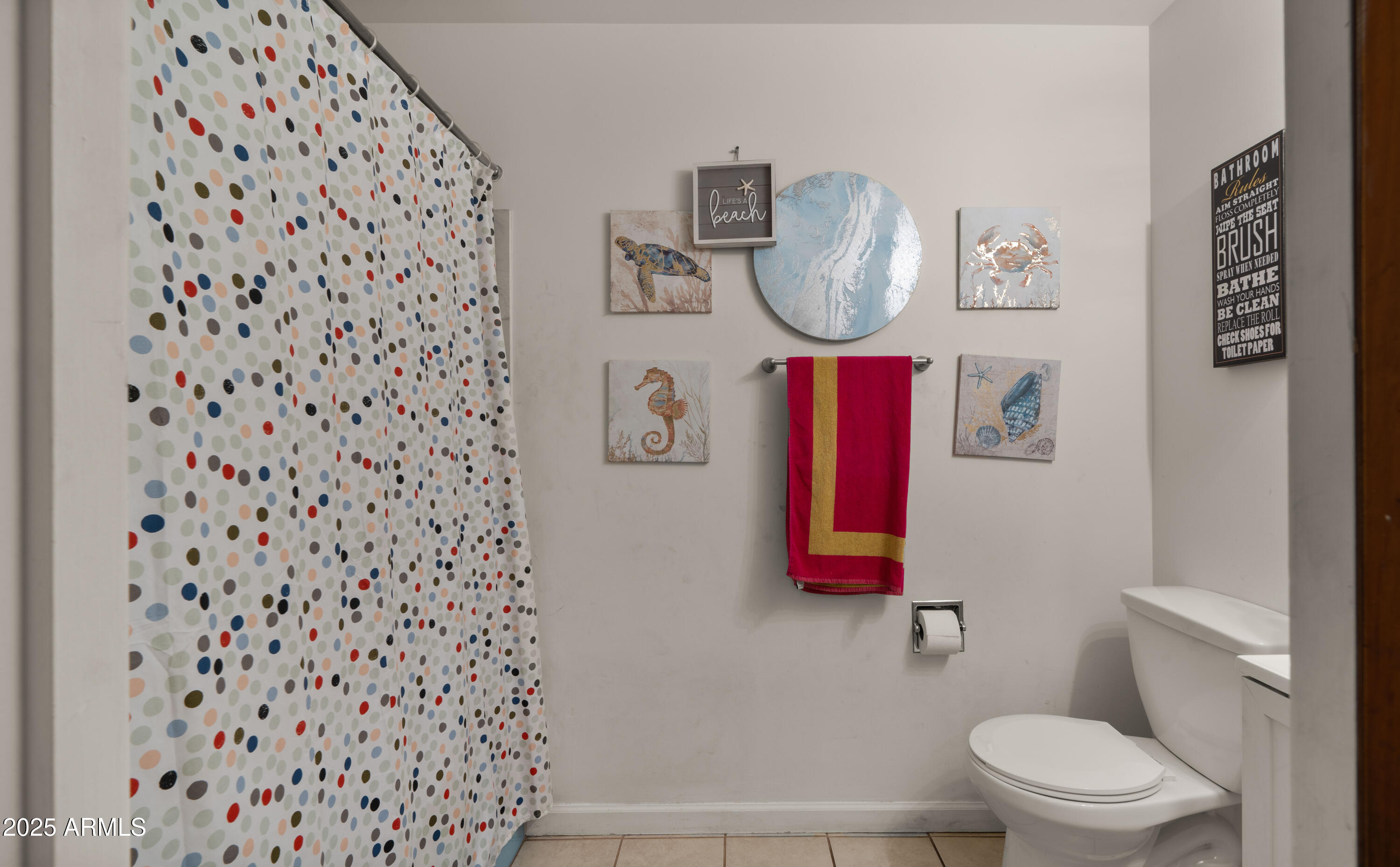 3501 East Coronado Road Phoenix, AZ 85008 - Photo 40 of 57 a bathroom with a toilet and a shower curtain