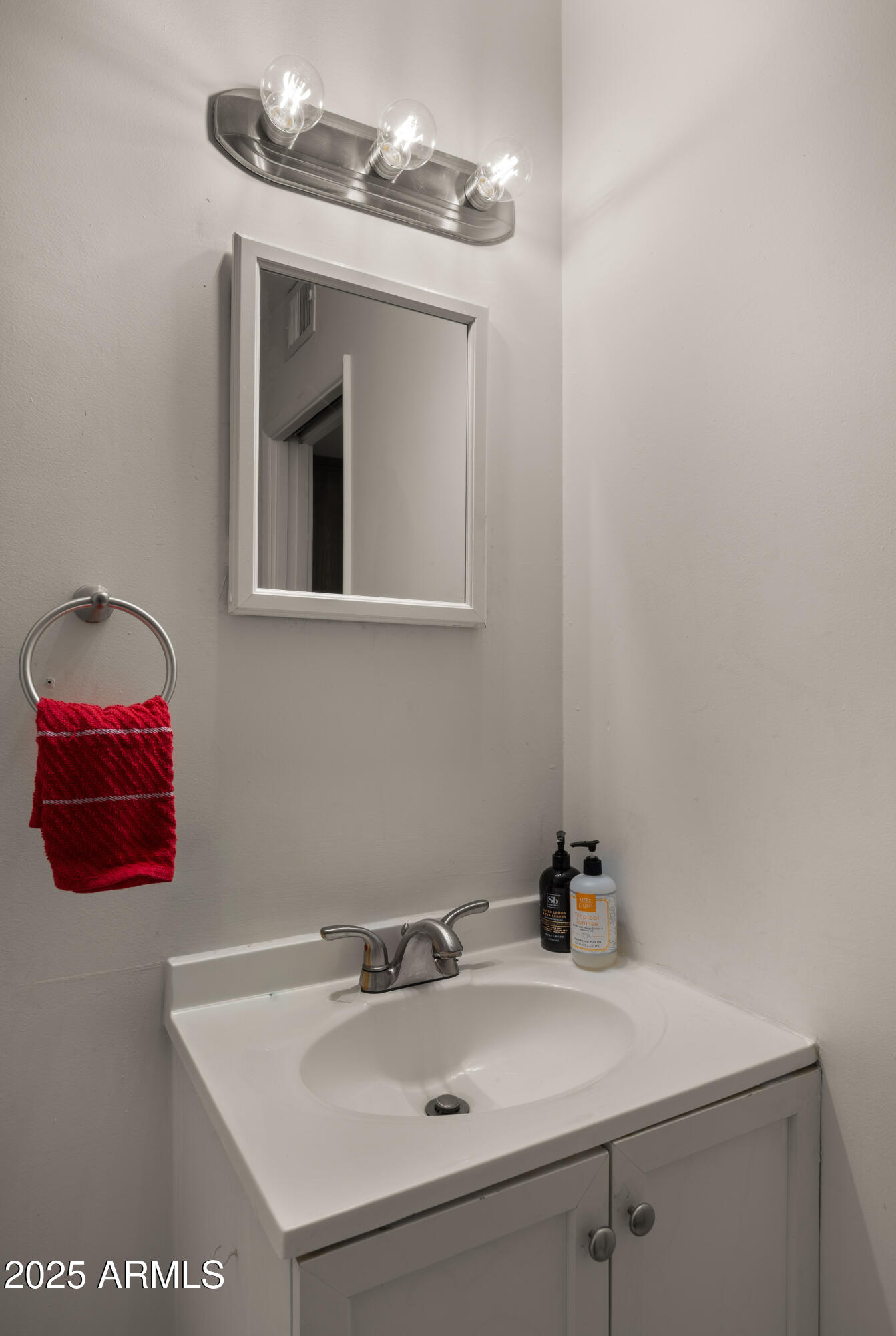 3501 East Coronado Road Phoenix, AZ 85008 - Photo 41 of 57 a bathroom with a sink and a mirror