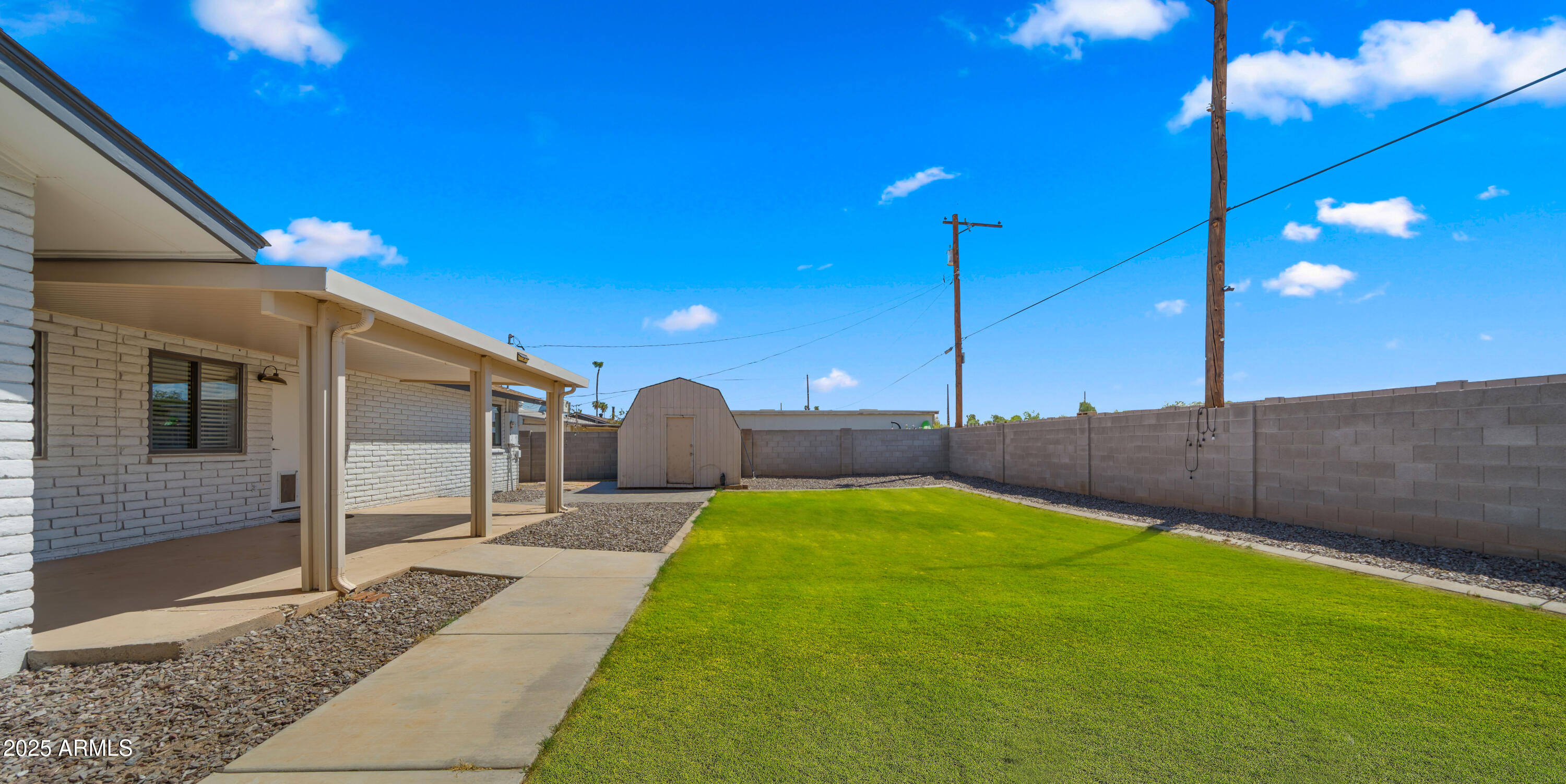 3501 East Coronado Road Phoenix, AZ 85008 - Photo 8 of 57 a view of a backyard with table and chairs