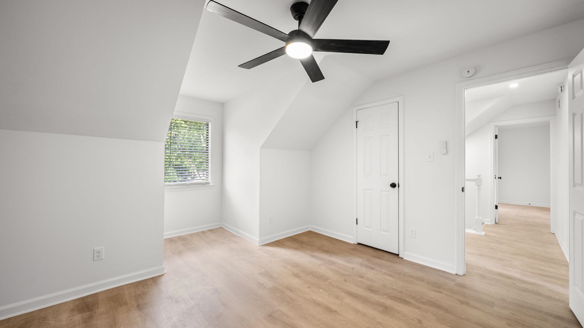 4351 Spring Oak Cove Memphis, TN 38125 - Photo 34 of 40 wooden floor in an empty room with a window