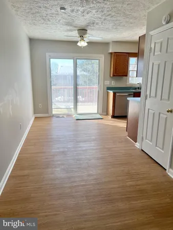 a view of kitchen with microwave refrigerator and microwave