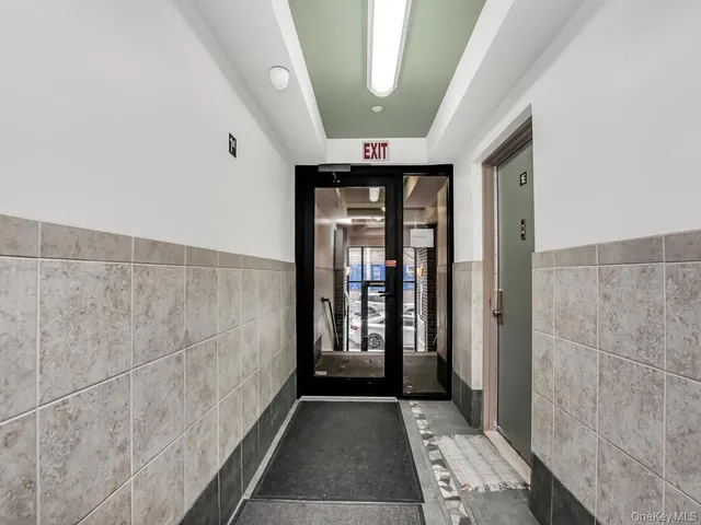 a view of gallery with wooden floor