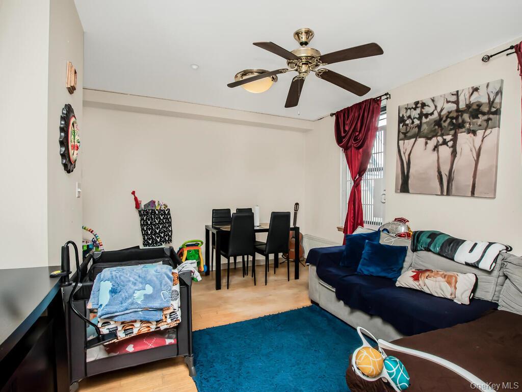 1347 Bristow Street, Unit 4B Bronx, NY 10459 - Photo 4 of 12 a living room with furniture and wooden floor