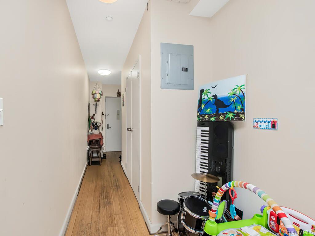 1347 Bristow Street, Unit 4B Bronx, NY 10459 - Photo 5 of 12 a room with toys and wooden floor