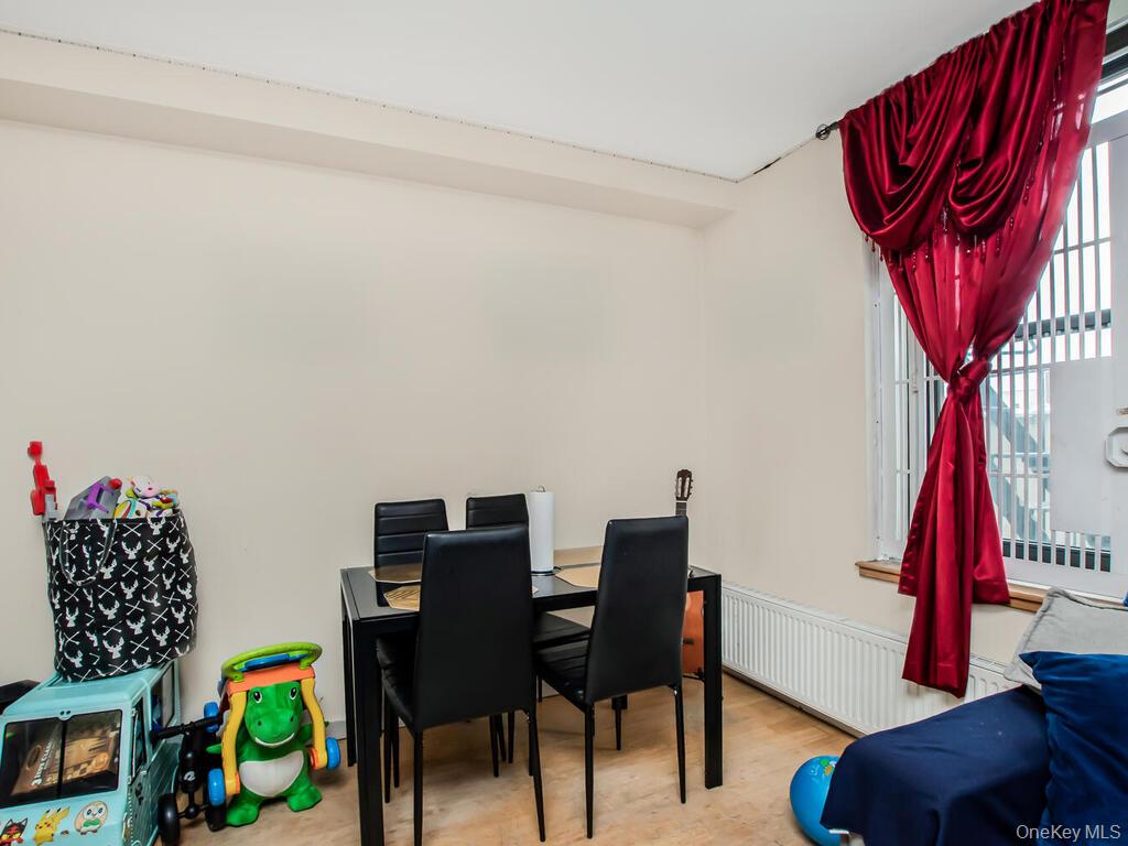 1347 Bristow Street, Unit 4B Bronx, NY 10459 - Photo 6 of 12 a view of a workspace with furniture and wooden floor