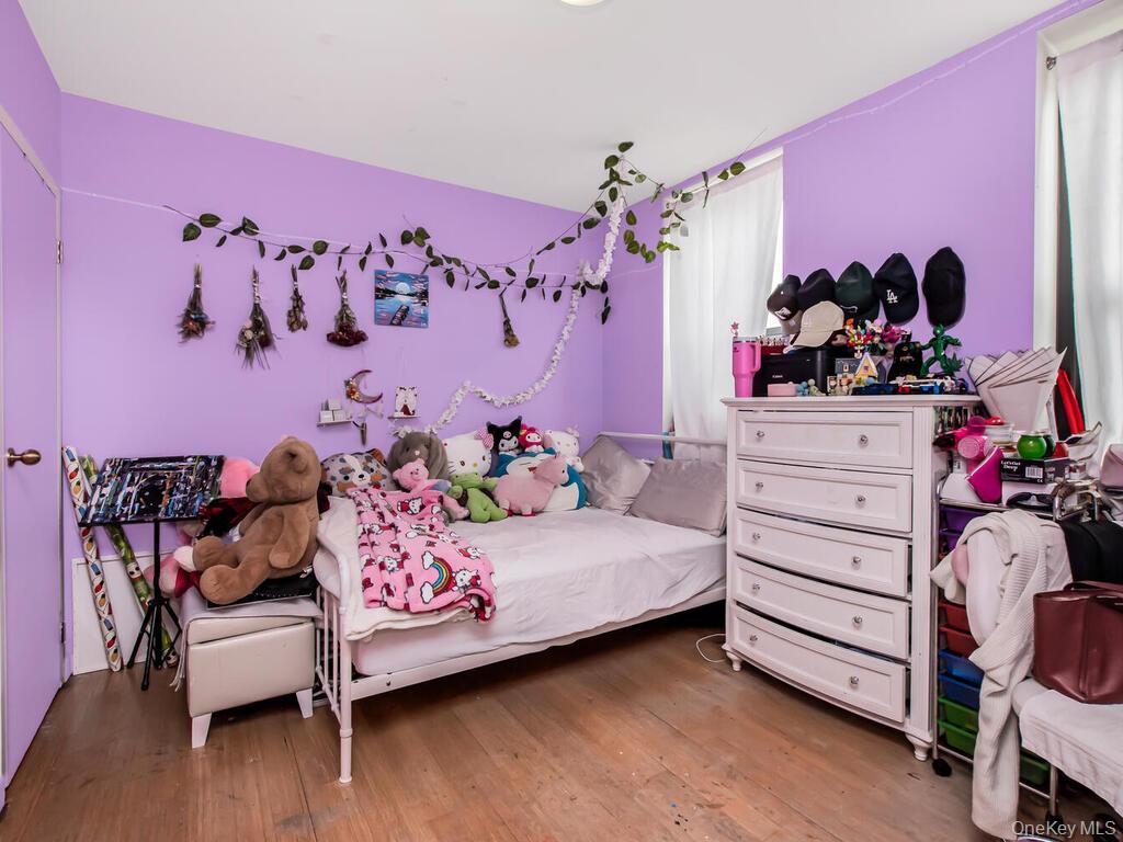 1347 Bristow Street, Unit 4B Bronx, NY 10459 - Photo 10 of 12 a bedroom with a bed and a dresser