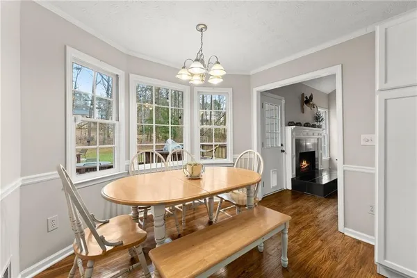a dining room with furniture and window