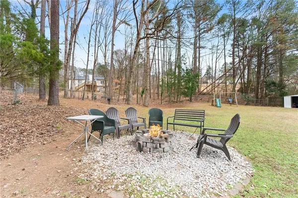 a view of a bench in a backyard
