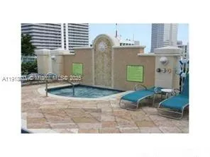 a view of a backyard with plants and palm tree