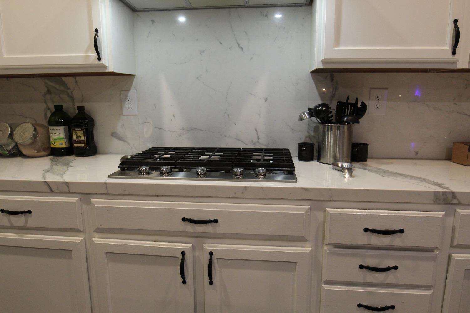 2653 Ashcroft Avenue Clovis, CA 93611 - Photo 11 of 45 a kitchen with a stove and cabinets