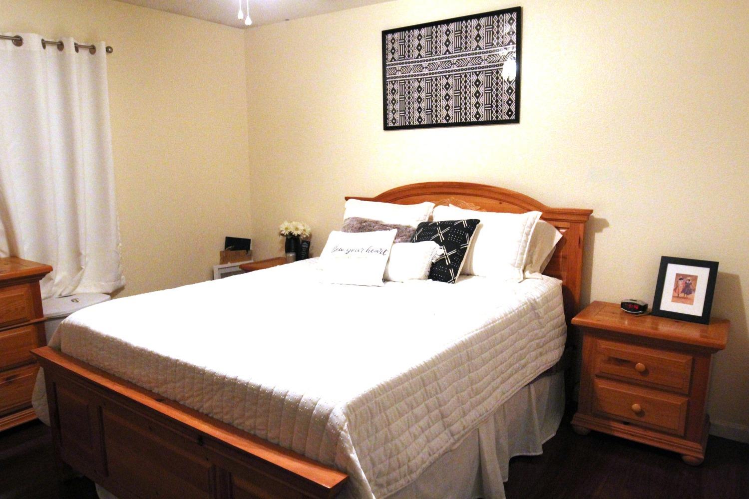 2653 Ashcroft Avenue Clovis, CA 93611 - Photo 16 of 45 a bedroom with a bed and a dresser