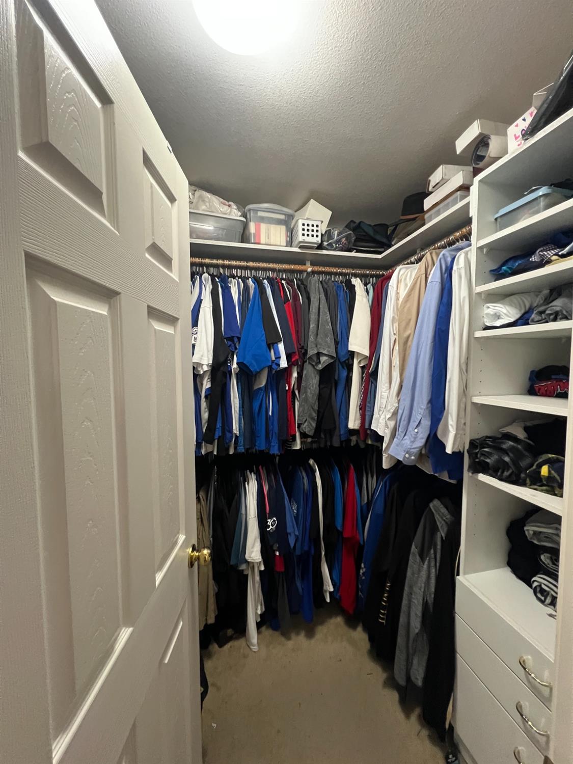 2653 Ashcroft Avenue Clovis, CA 93611 - Photo 29 of 45 a view of walk in closet with clothes and shoes