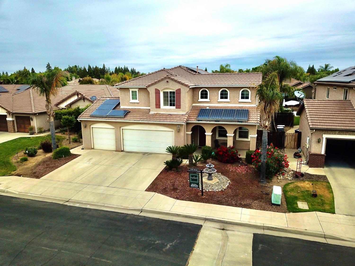 2653 Ashcroft Avenue Clovis, CA 93611 - Photo 41 of 45 a front view of house with yard outdoor seating and barbeque oven