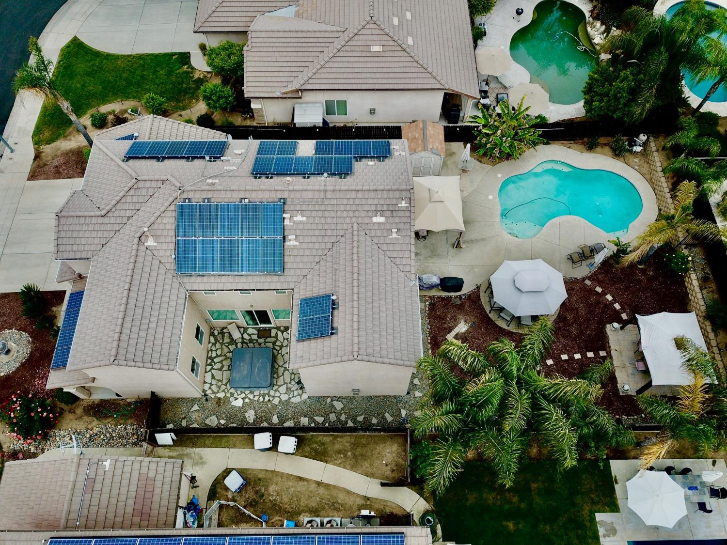2653 Ashcroft Avenue Clovis, CA 93611 - Photo 45 of 45 an aerial view of a house with a swimming pool and a yard