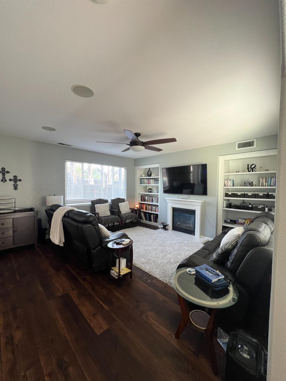 2653 Ashcroft Avenue Clovis, CA 93611 - Photo 5 of 45 a living room with furniture and a flat screen tv