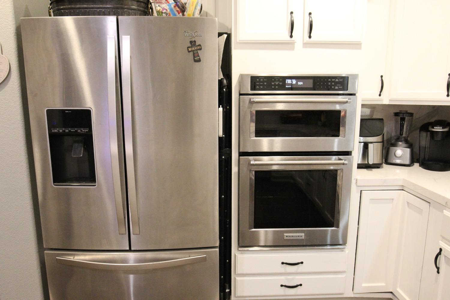 2653 Ashcroft Avenue Clovis, CA 93611 - Photo 10 of 45 a kitchen with a refrigerator sink and cabinets