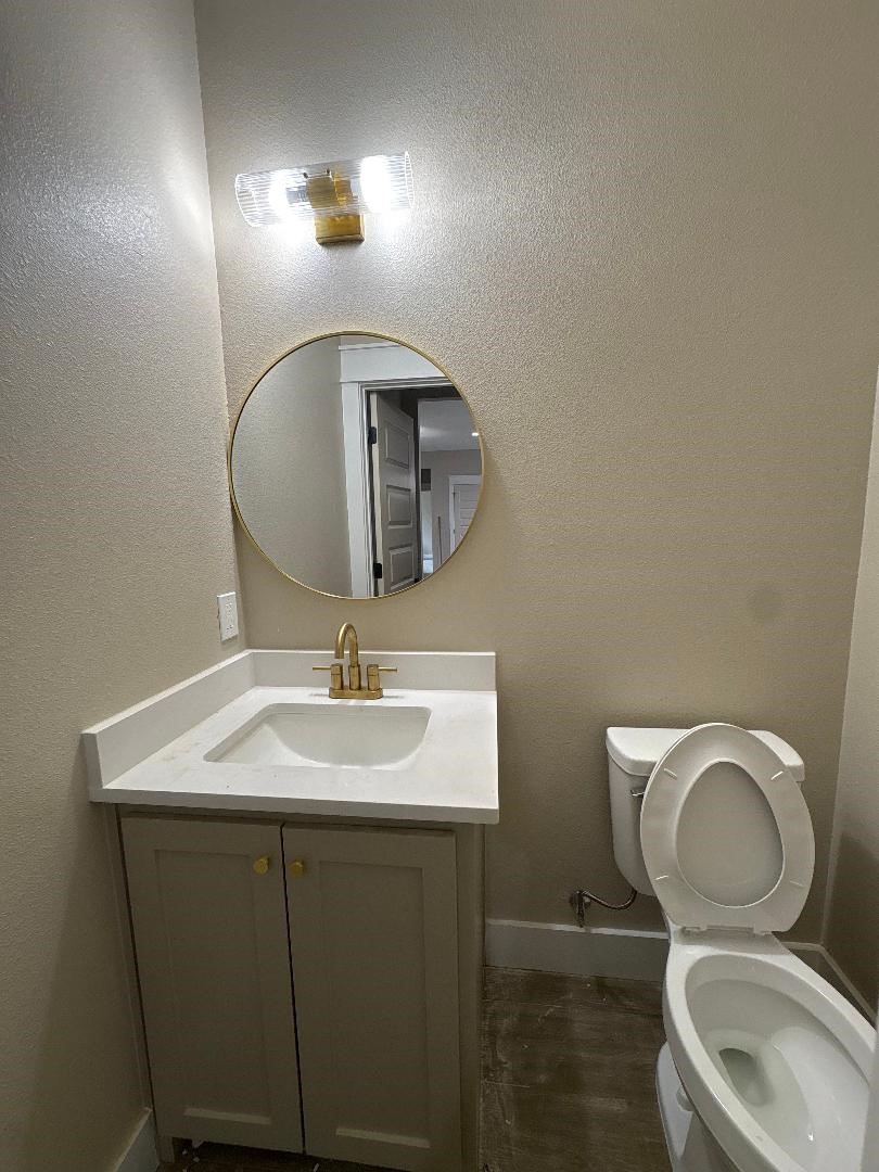 5680 Essie Lane Beaumont, TX 77713 - Photo 16 of 22 a bathroom with a toilet sink and mirror