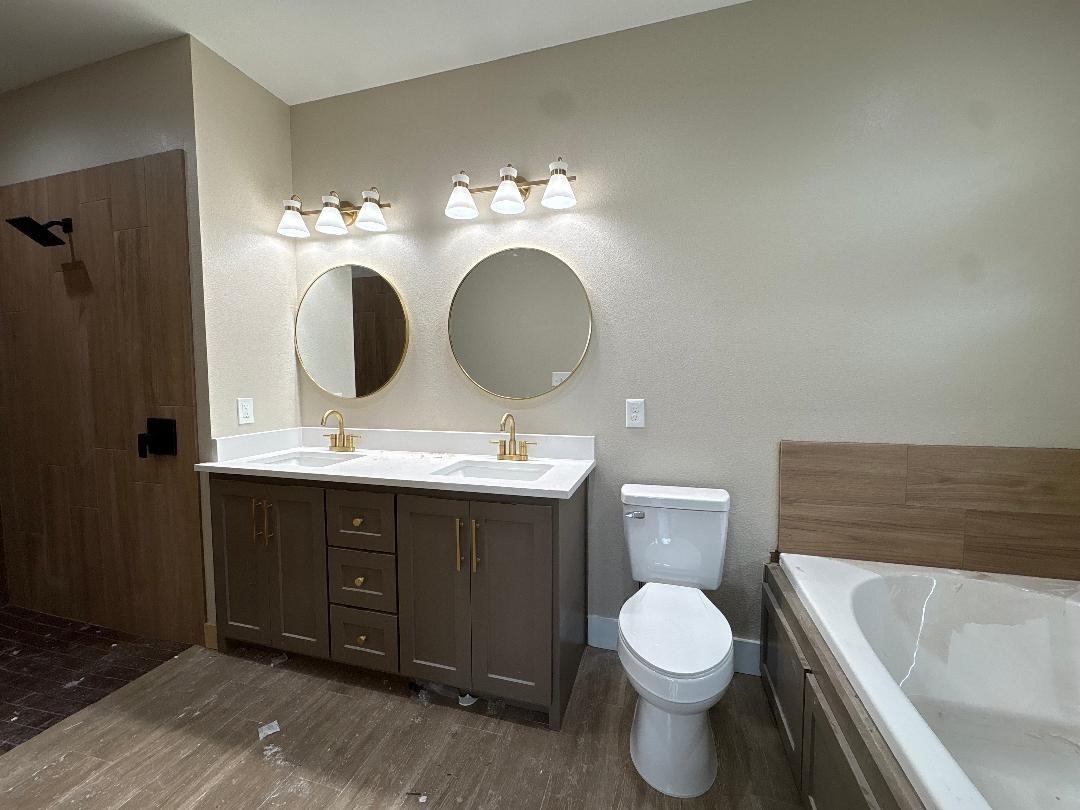 5680 Essie Lane Beaumont, TX 77713 - Photo 17 of 22 a bathroom with a toilet sink and mirror