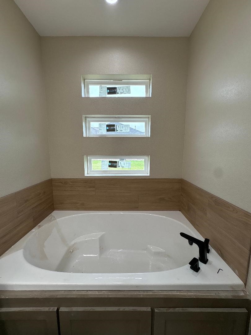 5680 Essie Lane Beaumont, TX 77713 - Photo 19 of 22 a bathroom with a bathtub