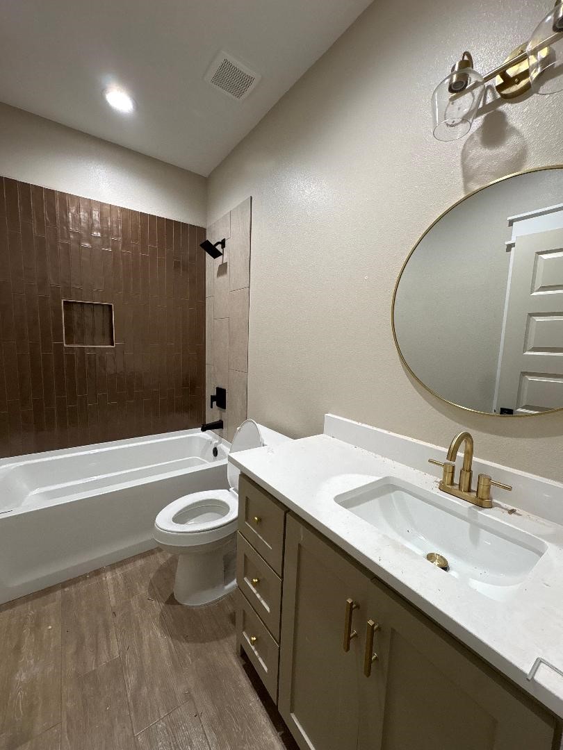 5680 Essie Lane Beaumont, TX 77713 - Photo 20 of 22 a bathroom with a double vanity sink and a mirror